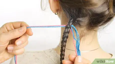 Imagen titulada Braid Your Hair With Thread Step 6