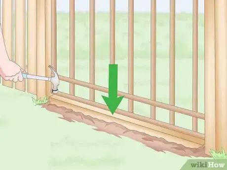 Imagen titulada Stop a Dog from Digging Under the Fence Step 1