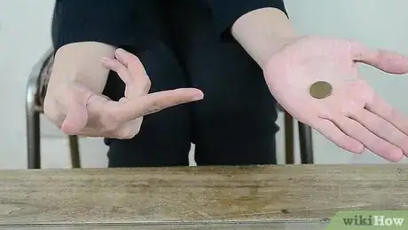 Imagen titulada Do a Simple Coin Magic Trick Step 6