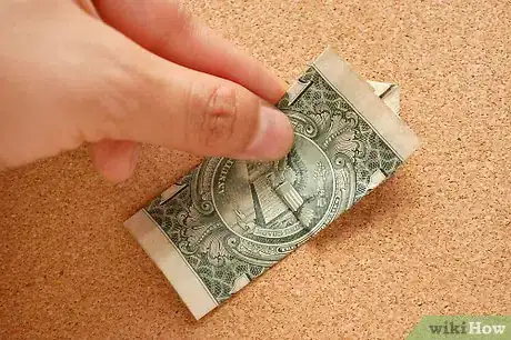 Imagen titulada Fold a Dime in a Dollar Bill Step 7