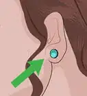 rouvrir un trou de piercing aux oreilles partiellement refermé