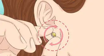 insérer une boucle d'oreille alors qu'elle n'entre plus dans le trou