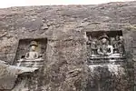 Whole Cave With Two Jain Figures Carved On The Rock Over It And Damaged Inscription