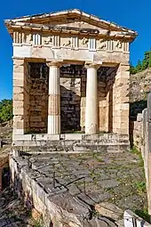 Ancient Greek Doric columns and entablature of the Athenian Treasury, Delphi, Greece, c.525 BC