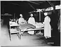 Surgical ward treatment at the 268th Station Hospital, Base A, Milne Bay, Left to right, Sgt. Lawrence McKr
