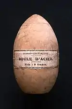 Wooden case of ovoid shape, on which is written: "Grande chartreuse - Boule d'acier".