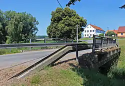Bridge over the Hořina creek with the municipal office in the background