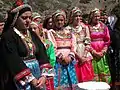 Local women dressed for a festival of Mary, mother of Jesus