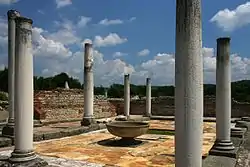 Ruins of a building with columns.