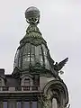 Finial figures and globe, Singer House. St. Petersburg, 1902–1904