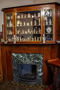 Displays of art objects in the cabinet, dating from 1930s