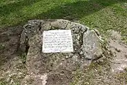 An inscription on a stone near the wells