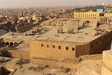 Windcatchers and shuksheika roofs shading narrow airshaft courtyards, Cairo Citadel.