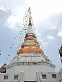 Another minor chedi on the junk, decorated with flags