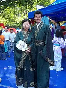 A woman wearing qujupao and a man wearing a zhiqupao, Chinese Cultural Festival in Guangzhou, 2008.