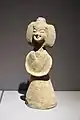 Earthenware Nanjing female figure wearing youren upper garment and a skirt with a straight-necked undergarment; d. Southern dynasty.