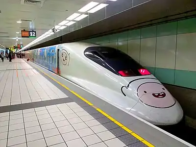 A high-speed passenger train with Finn painted on the nose and side
