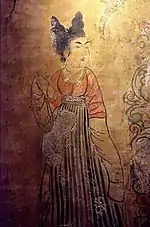 A Tang Dynasty Woman wearing a red U-shaped collar banbi under her skirt.