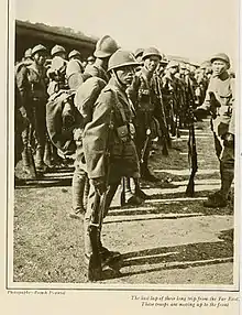 Old newspaper clipping of Asian soldiers