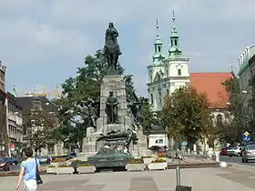 Jan Matejko Square in central Kleparz with Grunwald Monument in front of St. Florian Church and Academy of Fine Arts to the left