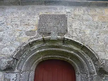 The inscription above the south porch of the Chapelle Saint-Adrien which reads in Breton "En bloaz mil pemp cant hanter cant nemet unan es voe fontet an chapel man en eil sul a mae en amser maest Herry a Castell rector Ploecastell ........ ha sant Adrian" which translates into French "En l'an 1549 fut fondée cette chapelle le second dimanche de mai, au temps de maître Henry du Chastel recteur de Plougastel et de Jean Kergoz dit Monot, gouverneur de cette chapelle, en l'honneur de Dieu, de Notre-Dame de Confort et de saint Adrien".