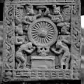 The Buddha represented by the Dharmacakra.