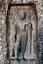 Standing Buddha (a later addition).
