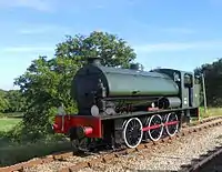 Hunslet Austerity 0-6-0ST WD198 'Royal Engineer' runs round the train at Wootton