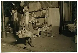 10:30 P.M. At Center Market. 11 yr. old Celery Vendor Gus Strateges, 212 Jackson Hall Alley. He sold until 11 P.M. and was out again Sunday morning selling papers ana gum. Has been in this country only a year and a half. Location: [Washington (D.C.), District of Columbia