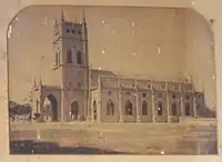 Old photograph of St. Andrew's Church displayed inside the church