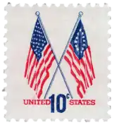 10¢ stamp released in 1973, showing a 50-star flag and a Betsy Ross flag together, to commemorate the United States Bicentennial.