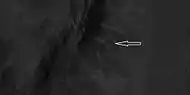 Close view of ridges from previous HiRISE image  Arrow indicates an "X" shaped ridge.