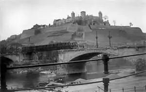 Bailey bridge built over bombed out Old Bridge at base of Marienberg Fortress by the 119th Armored Engineer Battalion of the U.S. 12th Armored Division, April 1945