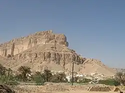 Buildings at the base of mountains in Wadi Hadhramaut