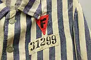 F (French) on a red triangle (political enemy) and ID-number 31299 on the Buchenwald-issue clothing of Dr Joseph Brau .mw-parser-output .citation{word-wrap:break-word}.mw-parser-output .citation:target{background-color:rgba(0,127,255,0.133)}^