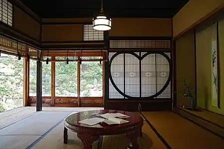Sukiya style, early 20th century. Garasu-do, sudare, shōji, and plaster walls visible. The garasu-do use large single glass panes, which would have been extremely expensive before float glass became available in the 1960s.