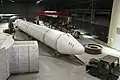 An SRMU rocket under tow in a restoration facility