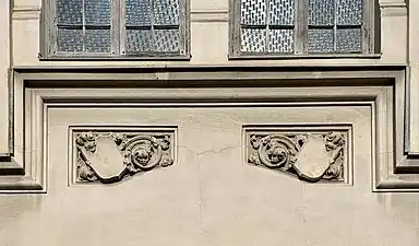 Gothic Revival shield-like cartouches on the Hermann I.Rieber carriage factory (Strada Romulus no. 17), Bucharest, by Siegfrid Kofczinsky, 1903