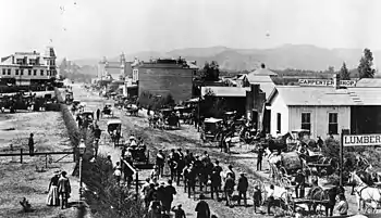 People of Pasadena celebrating the opening of the Los Angeles and San Gabriel Valley Railroad with a parade on September 30, 1886, on Colorado Street