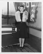 Miss Louise Leahy poses with the christening bottle