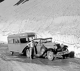 Car and tourist observation trailer, Glacier National Park, Montana, 1933