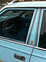 A stylized B pillar between the front and rear doors on an AMC Concord station wagon