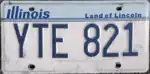 Illinois license plate design used throughout the 1980s and 1990s, displaying the Land of Lincoln slogan that has been featured on the state's plates since 1954