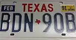 Vehicle registration plates of Texas used Avant Garde typeface for the state name on Passenger base plates from 1986 to 1990, and until 2002 on handicap and personalized plates.