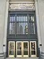 London Guarantee Building entrance commemorates Fort Dearborn at the top