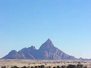 The Spitzkoppe of Namibia, a 670-metre (2,200 ft) granite peak formed by early Cretaceous rifting and magmatism.