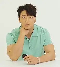 Yoon in green shirt in 2020