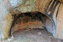 A rock painting of Bunjil.