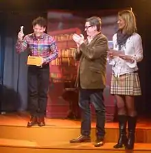 Nassim Al Fakir (left) receives the Alfons-Bokalen award 2013 from Tomas Alfredson (center)