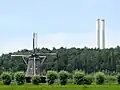 Wind mill Windesheimer molen with a factory in the background